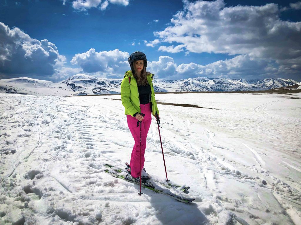 Woman wearing clothes to go skiing.
